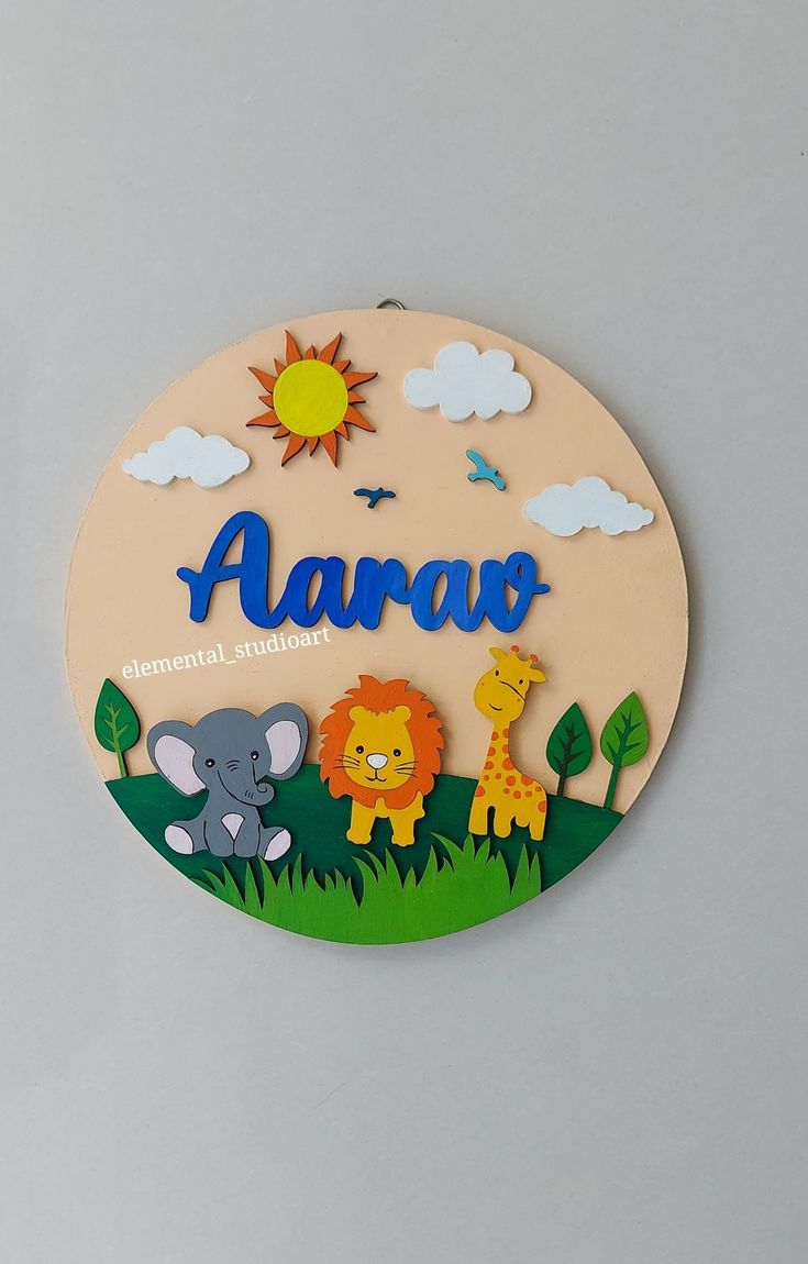 a wooden sign with animals and the word'aara'written in cursive writing