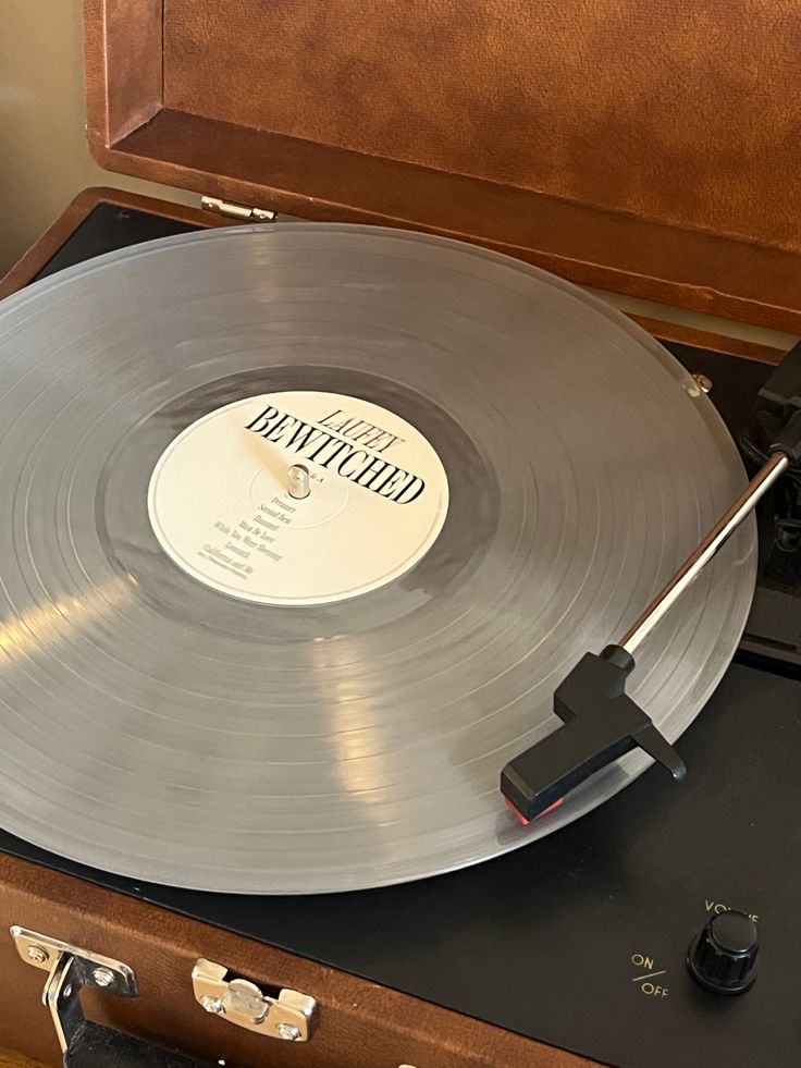 an old record player with its turntable open