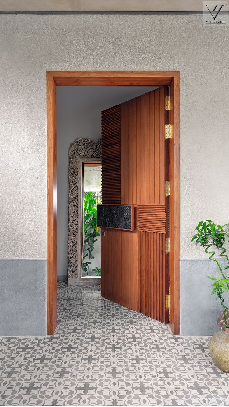 an open door leading into a room with tiled floors