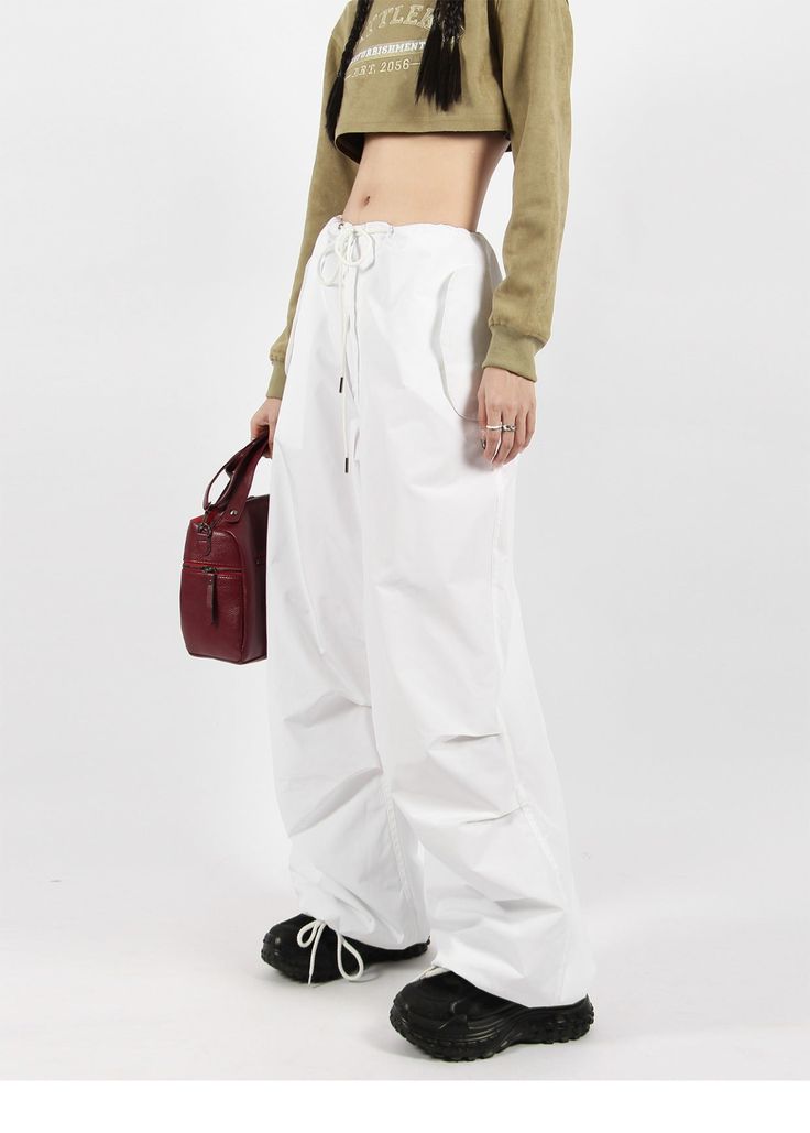 There’s a new trend in town, and it’s nightcity clothing’s Button Pocket Oversized Parachute Pants. These comfy, lightweight pants look great when paired with a crop top or graphic tee and sneakers. With a drawstring waistline, these pants are comfortable and secure, and the oversized fit gives them an effortless and chill look. Add these pants to your wardrobe, and you’ll never have a dull moment — you’ll always be ready for an impromptu night out, no matter how casual it might be.
Gender: Wome Cotton Straight Cargo Pants For Day Out, Cotton Wide Leg Pants For Streetwear, Baggy Parachute Pants For Spring, Versatile Baggy Parachute Pants For Spring, Loose Fit Wide Leg Pants For Spring Streetwear, Trendy Fall Parachute Pants For Loungewear, Trendy Parachute Pants With Loosely Fitted Hips For Loungewear, Chic Wide Leg Parachute Pants For Streetwear, Trendy Wide Leg Parachute Pants