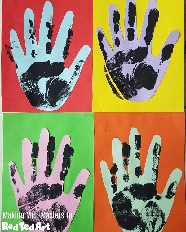 four handprints in different colors are shown on the paper with black and white hands