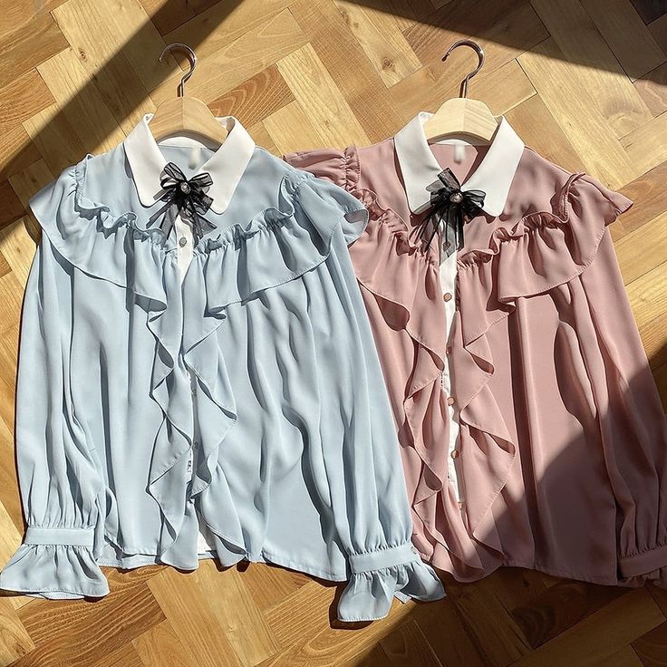 Casual academia shirt with long flared sleeves, ruffles and bow decoration Size SBust: 88cmLength: 57cm Size MBust: 92cmLength: 57cm Size LBust: 96cmLength: 57cm Size XLBust: 100cmLength: 57cm Material: Polyester, AcetateFabric Type: Chiffon Blue Long Sleeve Ruffled Shirt, Chic Blue Shirt With Ruffles, Long Sleeve Shirt With Bow For Spring, Blue Blouse With Ruffled Collar And Details, Blue Ruffled Shirt For Fall, Blue Doll Collar Top For Spring, Spring Bow Collar Blouse, Blue Ruffled Shirt For Summer, Light Blue Feminine Blouse With Ruffles