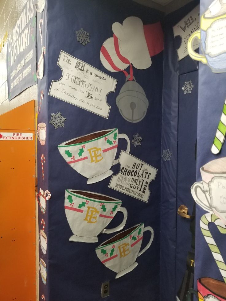 an open door decorated with coffee cups and other items on display in a store or office