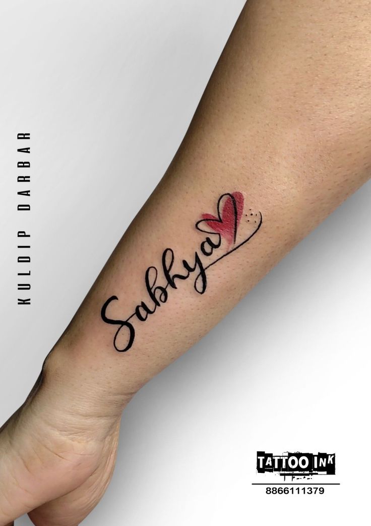 a woman's arm with a tattoo that says sulkyo on the wrist