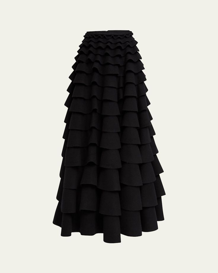 Valentino Garavani skirt finished with tiered ruffles    High waist    Hem falls below the knee    Aline silhouette    Invisible back zip    Virgin wool    Professional cleaning recommended    Made in Italy Chic Tiered Voluminous Skirt, Chic Voluminous Tiered Skirt, Chic Tiered Voluminous Maxi Skirt, Chic Voluminous Tiered Maxi Skirt, Elegant Tiered Voluminous Skirt, Elegant Tiered Maxi Skirt For Party, Formal Skirt With Voluminous Ruffles, Formal Voluminous Skirt With Ruffles, Evening Midi Dress With Ruffled Skirt