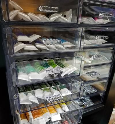 the drawers are filled with different types of items