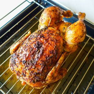 a roasting rack with chicken on it