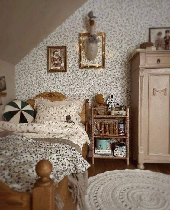 a bed room with a neatly made bed next to a night stand and dressers