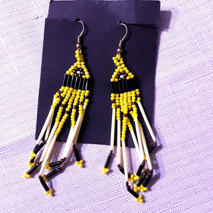 Hanging Yellow And Black Bead Earrings. Brand New Adjustable Yellow Beaded Earrings With Ear Wire, Yellow Beaded Drop Earrings For Festival, Adjustable Yellow Beaded Earrings, Yellow Beaded Earrings With Ear Wire For Festivals, Traditional Yellow Beaded Earrings, Yellow Round Beaded Earrings For Festival, Yellow Beaded Earrings For Festival, Festival Yellow Beaded Earrings With Dangling Beads, Yellow Festival Beaded Earrings