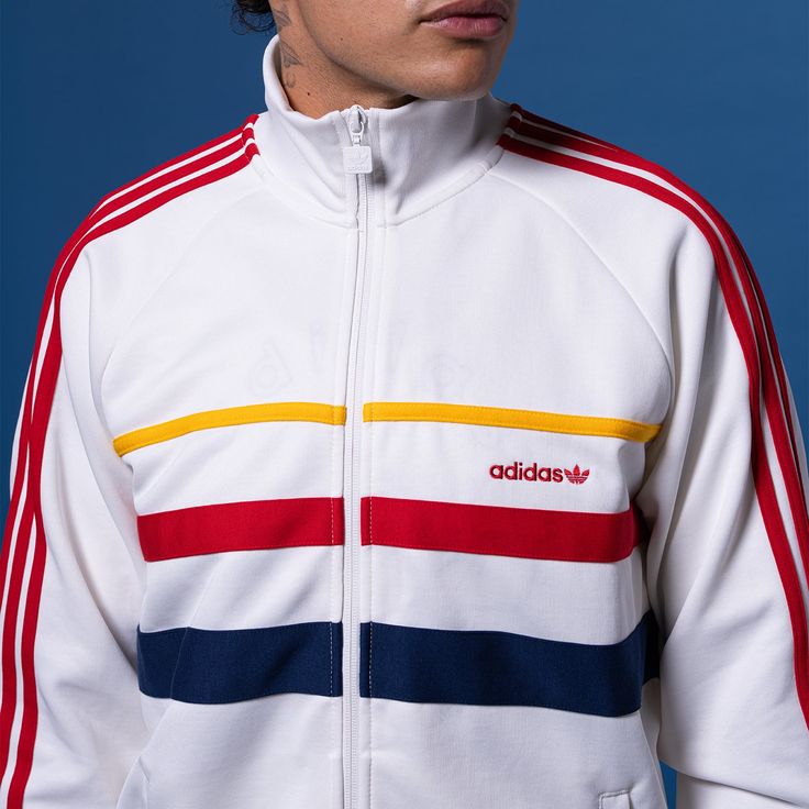 Take your style back in time with the retro-looking adidas Sport Leaf First Men's Track Jacket. While the colors give it that throwback look, the soft material will keep you comfortable, even when you have a long day ahead of you. And this jacket has a relaxed fit, allowing you to layer it with a tee or sleeveless or lightweight, long-sleeved shirt.Easy to layer. Fitted hem and cuffs. Features side pockets. Long-sleeved. Zip-up. Machine washable. White Adidas Hooded Track Jacket, Retro Track Jacket With Ribbed Cuffs For Streetwear, Retro Streetwear Track Jacket With Ribbed Cuffs, Casual White Track Jacket With Side Stripes, White Adidas Logo Sportswear Outerwear, White Sporty Track Jacket With Contrast Stripes, Sporty White Track Jacket With Contrast Stripes, White Adidas Sportswear Outerwear, White Long Sleeve Track Jacket With Adidas Logo