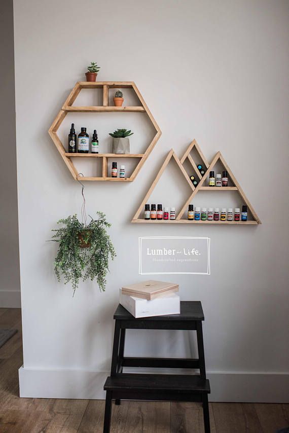 the shelves are made out of wood and have various bottles on them, as well as a potted plant