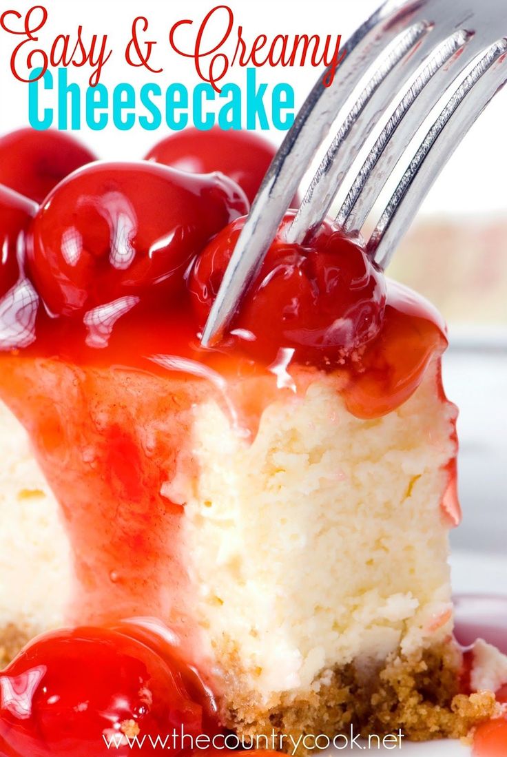 a piece of cheesecake with cherries on top is being held by a fork