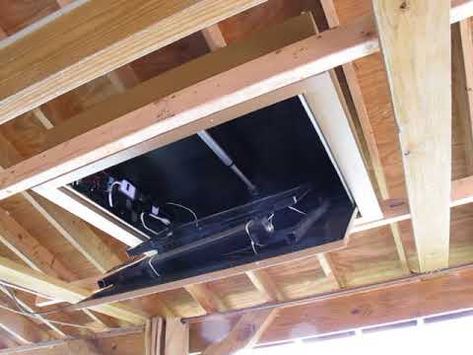 the ceiling is covered with wood and wires