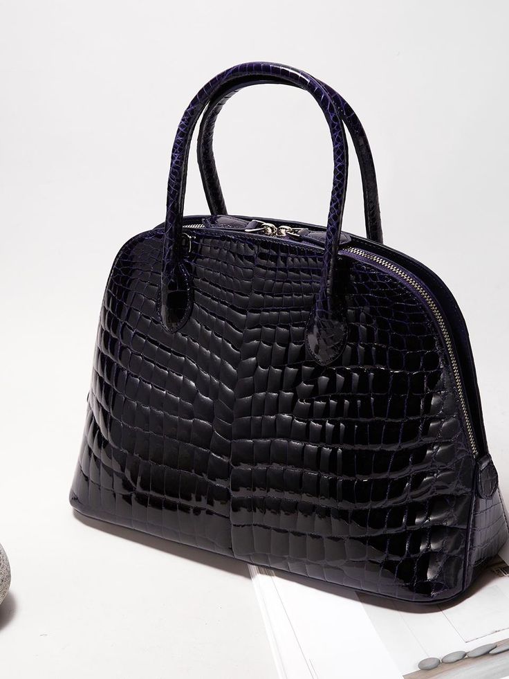 KRIS TALLEN's design, which combines classicism and post-modernism, aims for chic and produces crocodile bags that do not follow trends but add luxury through sturdy and sophisticated production that can be passed down from generation to generation. - Lightweight crocodile leather used- Practical design with three different structures- Can be worn in three ways: tote, shoulder or cross- Detachable strap for various styles High-end Travel Bags With Crocodile Pattern, Luxury Handheld Shoulder Bag With Crocodile Pattern, Luxury Crocodile Pattern Handheld Bag, Luxury Crocodile Pattern Shoulder Bag For Daily Use, High-end Leather Bag With Crocodile Pattern, Luxury Rectangular Satchel With Crocodile Pattern, Designer Crocodile Pattern Top Handle Shoulder Bag, Luxury Crocodile Pattern Tote Satchel, Classic Everyday Luxury Bag With Crocodile Pattern