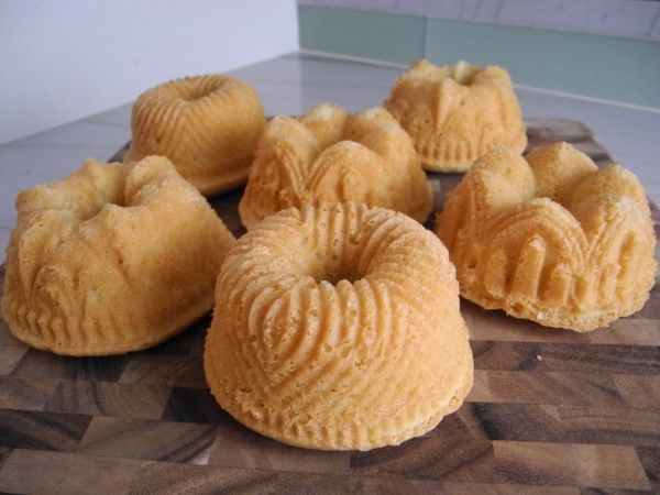 several buns are sitting on a cutting board