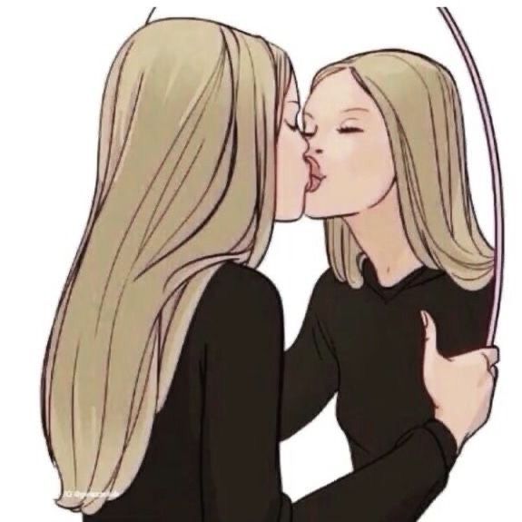 two women kissing each other with long blonde hair