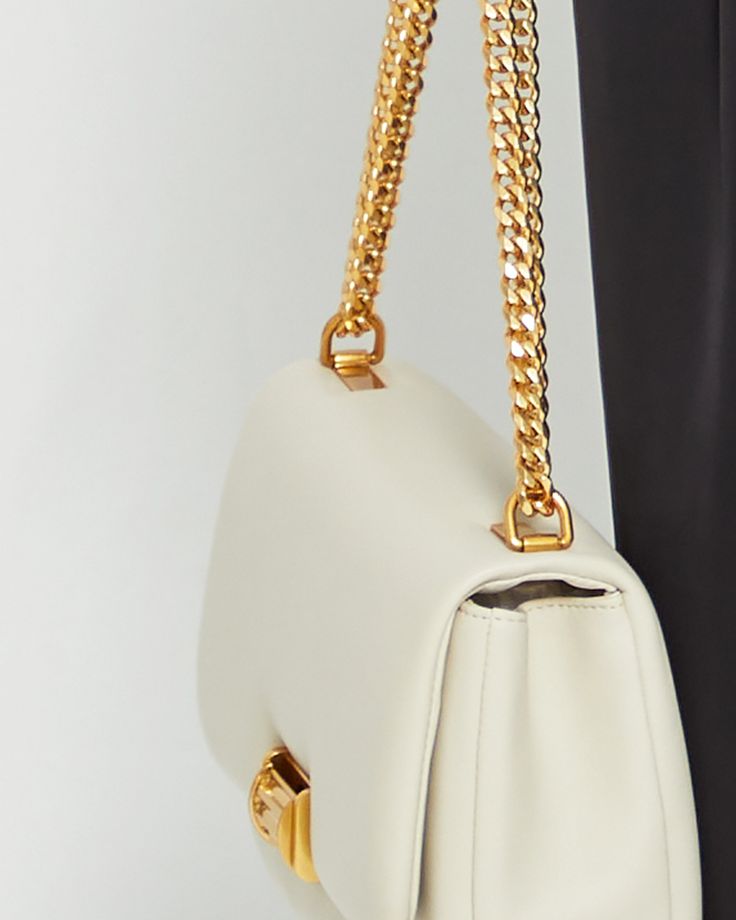 Product Details Our take on the classic chained shoulder bag. Made with premium Italian leather and gold hardware for an ultra luxe look and feel. This simple yet sophisticated design is a new staple. - Gold chain to either hang over shoulder or style crossbody- Clasp fastening at front flap- Internal pocket with zipper- Content: Outer: 100% cow leather; Lining: Faux leather Style# K2103NPPR01L1 Fit Notes - This item measures approximately 10.24 x 6.10 x 2.76" - Chain measures approximately 41.3 Office Crossbody Shoulder Bag With Gold Chain, Luxury Bags With Chain Strap For Everyday, Gold-tone Chain Link Shoulder Bag, Timeless Bags With Chain Strap, Modern Shoulder Bag With Chain Strap For Office, Chain Link Shoulder Bag With Gold-tone Hardware, Elegant Bag With Detachable Strap And Chain Link Shape, Elegant Bag With Gold Chain Link, Elegant Shoulder Bag With Gold Chain For Everyday