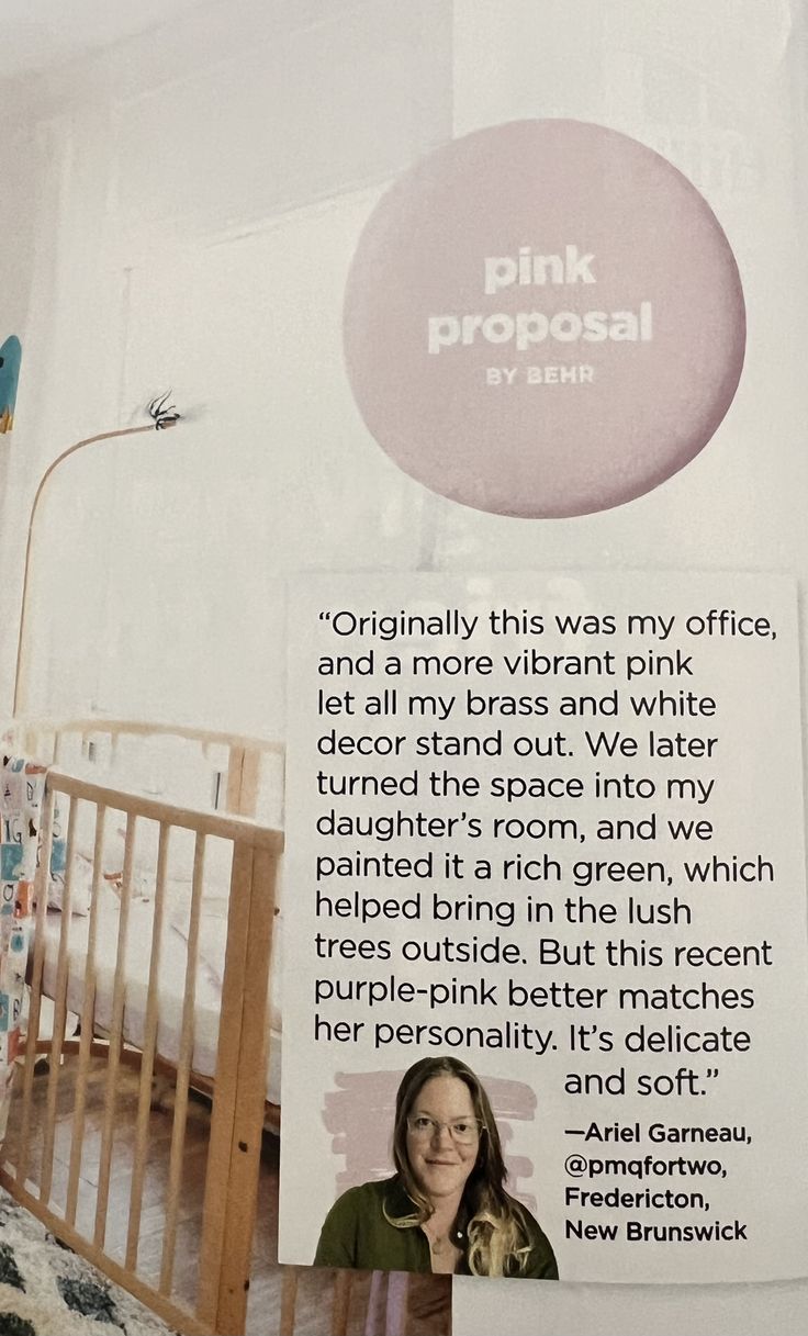 an advertisement for pink proposal on the wall in a baby's room