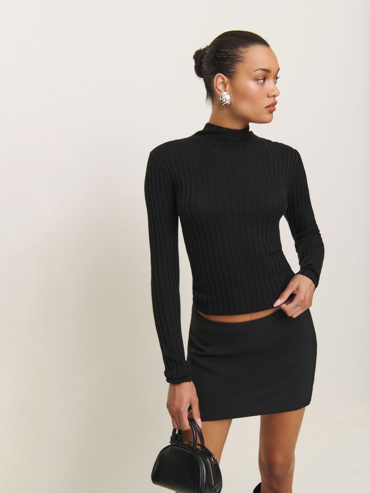 Layer up. Shop the Cori Ribbed Turtleneck Sweater from Reformation, a long-sleeve, lightweight sweater with a mock neckline and ribbing throughout. Black Turtle Neck Layered Outfit, Turtle Neck Layered Outfit, Chic Ribbed Turtleneck Knit Top, Stretch Long Sleeve Turtleneck For Night Out, Long Sleeve Turtleneck For Spring Workwear, Spring Long Sleeve Turtleneck For Work, Long Sleeve Turtleneck For Work In Spring, Spring Workwear Long Sleeve Turtleneck, Chic Ribbed Fitted Mock Neck Top