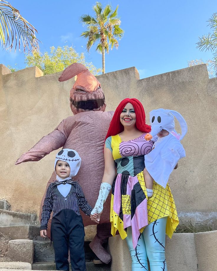 two children and an adult dressed in costumes