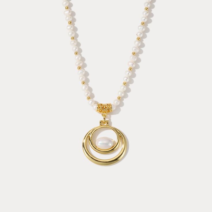 Adorn your neck with the remarkable elegance of our Oval Pearl Necklace. Crafted with 18k gold, this luxurious accessory will complete any ensemble with its timeless sophistication. With its alluring classic design, its sure to make a statement of timeless style. DETAILS Plating: 18K Gold Materials: 18K Gold on Brass, Freshwater Pearl Measurements: Length: 16.54"(42.0cm) + Extender: 2.36"(6.0cm) Weight:  36.59 g Gold Necklace With Pearl Chain And Oval Pendant, Gold Oval Pearl Necklace With Pearl Charm, Oval Gold Pearl Necklace With Pearl Charm, Oval Gold Necklace With Pearl Chain, Gold Oval Pendant Pearl Necklace, Elegant Pearl Charm Necklace With Oval Pendant, Oval Gold Pearl Necklaces, Gold Pearl Necklace With Oval Shape, Elegant Gold-tone Pearl Chain Necklace