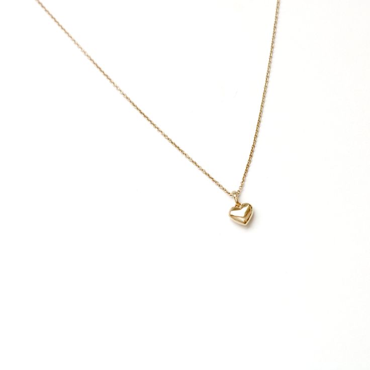 Embrace the timeless charm of love with our 14K solid gold Mini Puffy Heart Pendant Necklace. This delicate and elegant piece features a beautifully crafted heart pendant, measuring 5mm x 5.5mm, with a total height of 7.5mm including the bail. Perfect for celebrating love and affection, this necklace is a versatile accessory that adds a touch of warmth and elegance to any look. A heartfelt addition to your jewelry collection or a meaningful gift for someone special. Puffy Heart Necklace, Love And Affection, Puffy Heart, 21 Days, Heart Pendant Necklace, Heart Shape, Heart Necklace, Heart Pendant, Beautiful Jewelry