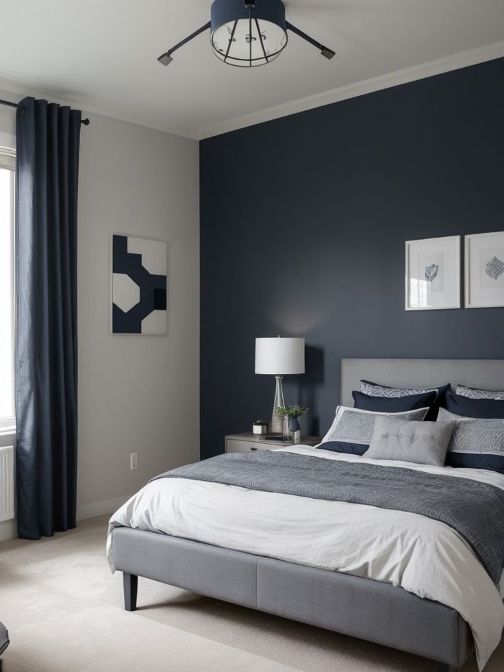 a bedroom with blue walls and white bedding