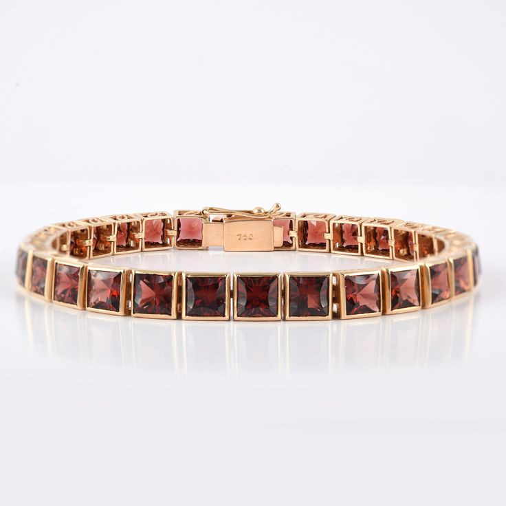 This is a classic style tennis bracelet. A must-have statement piece for every woman. It's a classic luxury to have. A perfect gift for your loved ones. -Material - 18K Solid Yellow Gold -Gemstone - Genuine Garnet -Gemstone Weight - 23.510 ct -Gross weight - 20.85 grams Garnet Benefits:- Helps ignite love and passion. Strengthens one's personal energy. Heightens creativity and inspiration. Improves one's daily energy levels. Establishes faith and trust. Opens the heart. Builds self-esteem. Promo 18k Gold Bracelet, Personal Energy, Daily Energy, Garnet And Gold, Gold Armband, Garnet Bracelet, Birthstone Bracelet, January Birthstone, Birthstone Bracelets