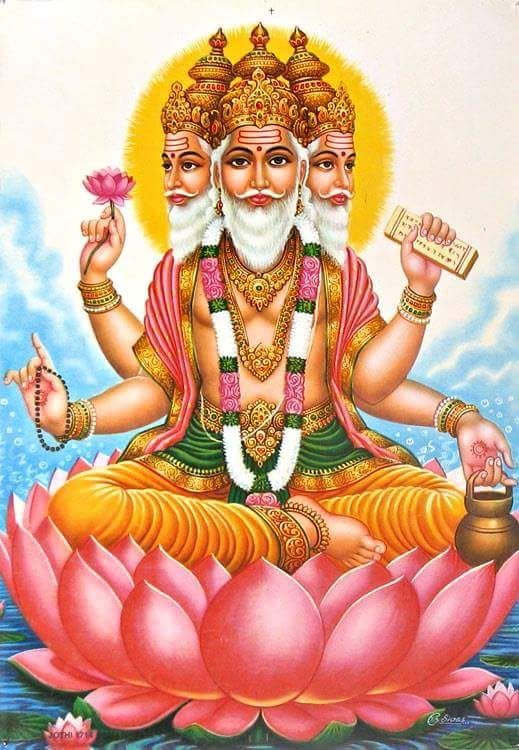 the god is sitting on top of a lotus with his hands in one hand and holding a