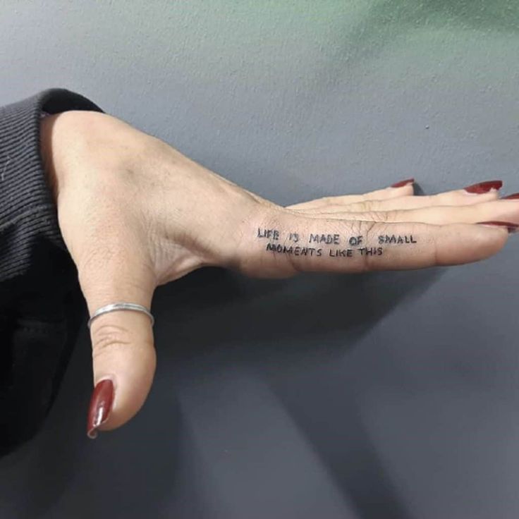 a woman's hand with the words life is more than small on her left arm