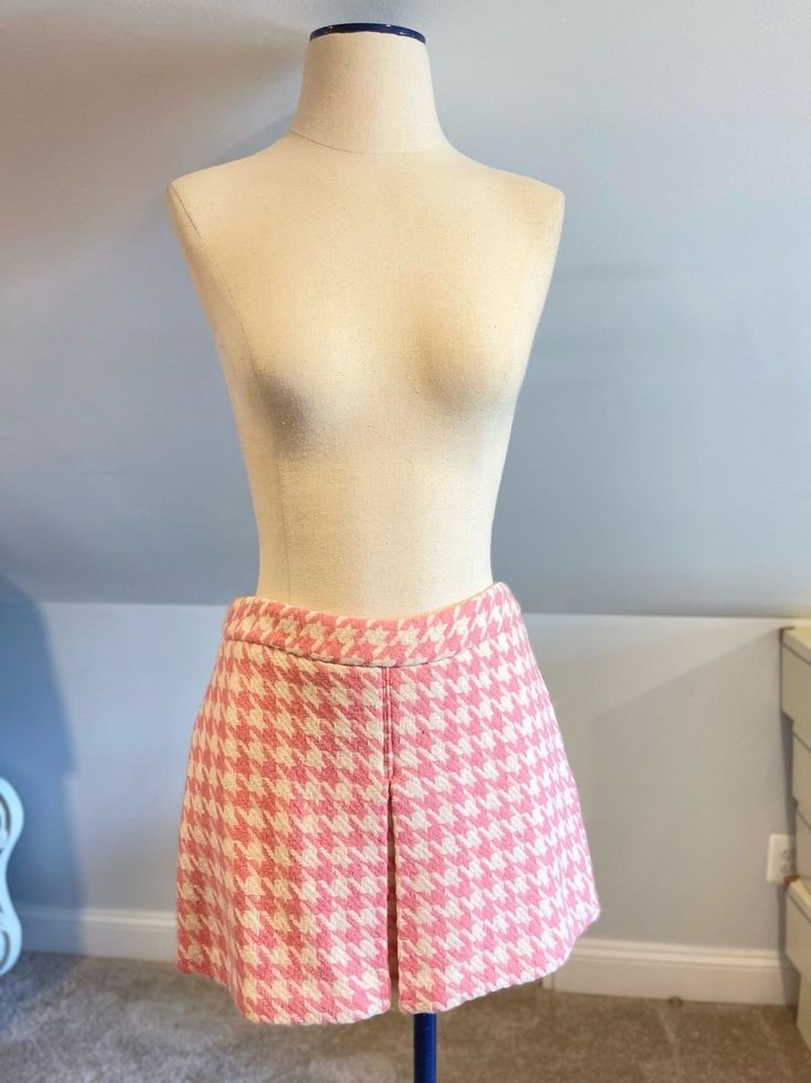 "\"Paul & Joe\" pink houndstooth mini skirt  Looks similar to a skort, but is not  Zip up and hook closure in back  Shell: wool, polyester Lining: Rayon  Dry clean for optimal results  Tagged size 7  Made in China  Measurements Waist: 15 in  Hips: 18 in Length: 14.5 in" Mini Length Bottoms With Houndstooth Pattern For Spring, Pink Mini Length Skort For Workwear, Plaid Short Length Skort For Spring, Plaid Short Skort For Spring, Pink Mini Length Bottoms For Work, Chic Plaid Skort For Spring, Chic Pink Skort For Workwear, Pink Short Length Skort For Work, Pink Skort For Spring Workwear