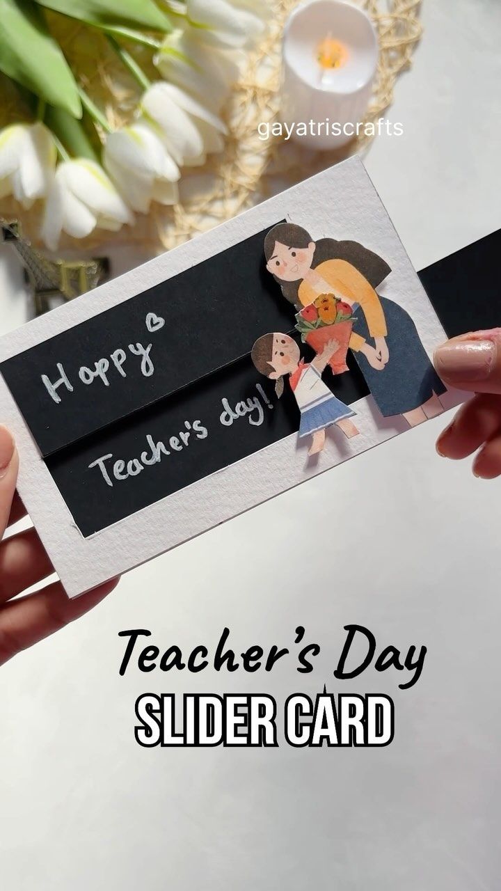 two hands holding up a card that says happy teachers day slider card