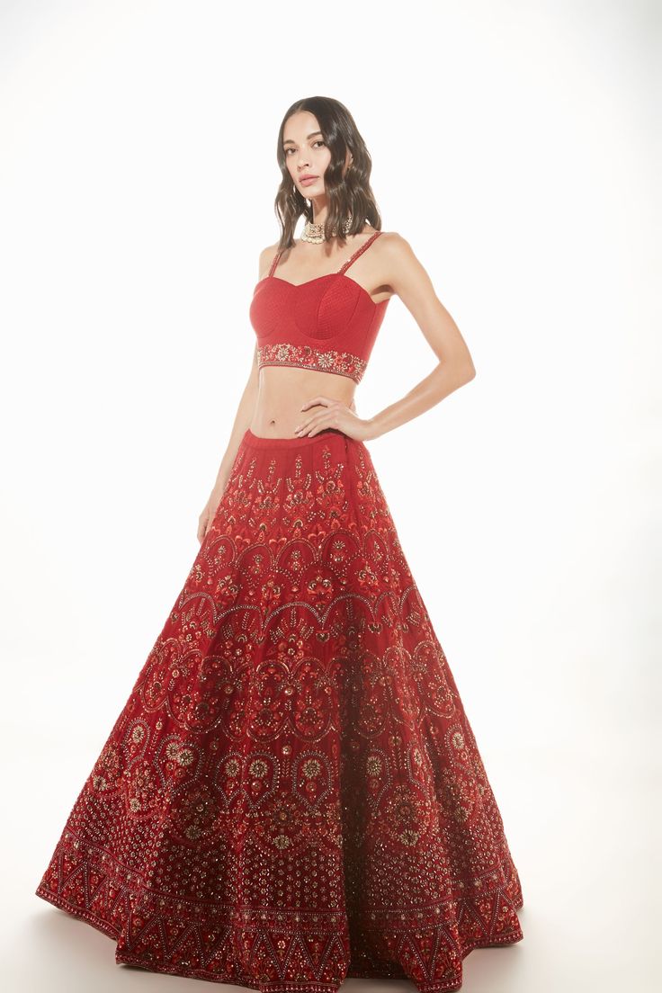 A red raw silk skirt with resham, sequins, and mirror embroidery paired with a quilted bralette and net dupatta From Chamee and Palak 's The Wedding Edit collectionDELIVERY TIMEPlease allow 8-12 weeks for your outfit to arrive.FABRIC DETAILSRaw silk and NetProfessional cleaning only. Wedding Edit, Raw Silk Lehenga, Mirror Embroidery, Corset Blouse, Silk Lehenga, Net Dupatta, Red Outfit, Silk Skirt, Modern Bride