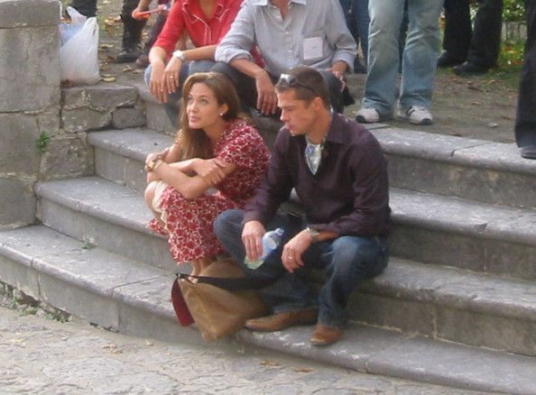 a group of people sitting on some steps