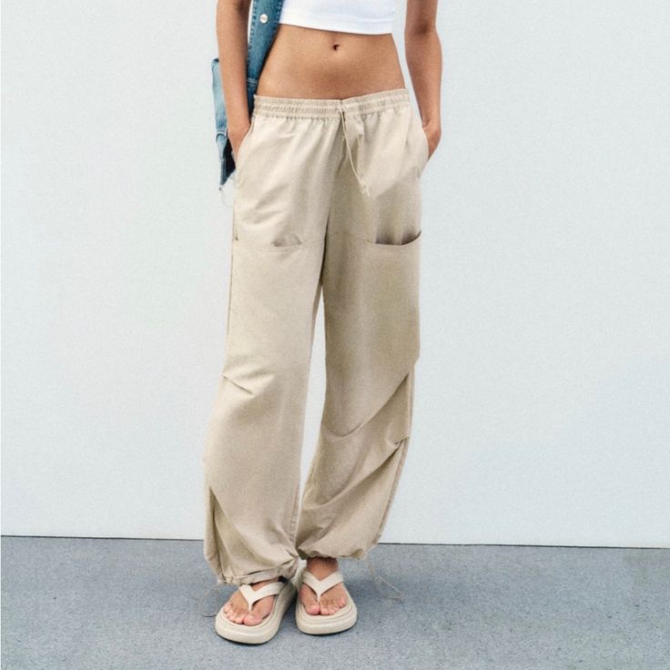 Nwt // Zara - Mid Rise Nylon Pants Size: L Color: Mid-Ecru (Pale Beige Tone) Nwt // Never Worn See Image For Fit/Fabric Details Blogger Favorite Summer Parachute Pants With Pockets For Leisure, Summer Leisure Parachute Pants With Pockets, Beige Parachute Pants With Pockets For Summer, Full Length Khaki Parachute Pants For Spring, Beige Cargo Style Parachute Pants For Fall, Leisure Parachute Pants With Pockets For Spring, Beige High Waist Summer Cargo Pants, Beige High Waist Relaxed Fit Sweatpants, High Waist Beige Relaxed Fit Sweatpants