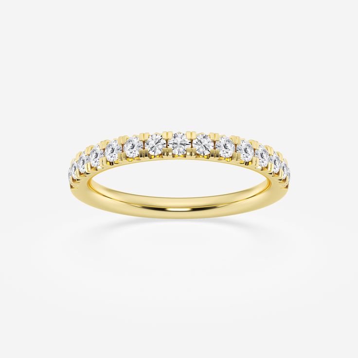 a yellow gold wedding band with white diamonds