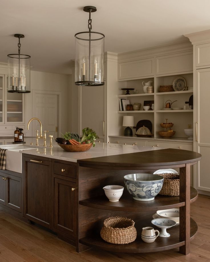 a kitchen island with bowls and plates on it