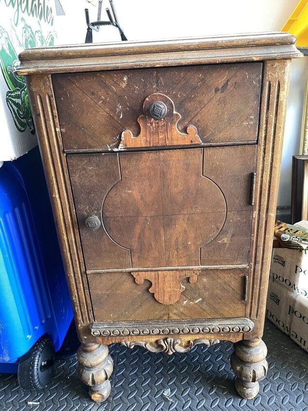 an old wooden cabinet sitting on top of a floor