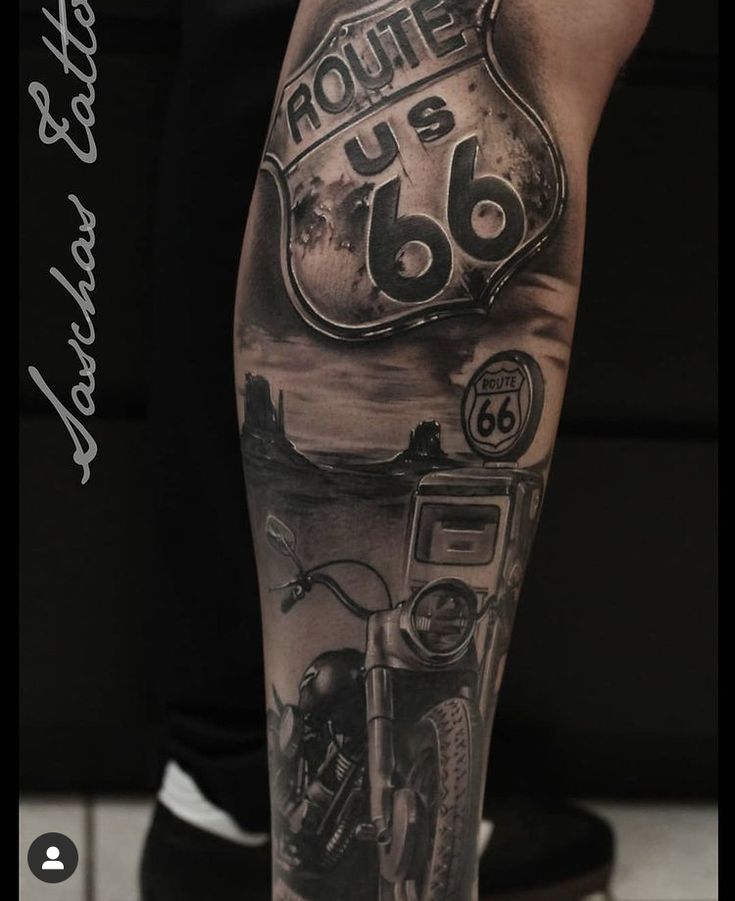 a black and white photo of a man's leg with an old school motorcycle tattoo on it