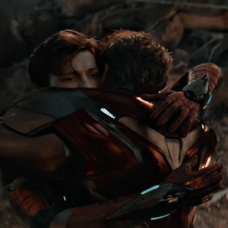 two people hugging each other in the middle of a scene from iron man 3, which appears to be being directed by sony