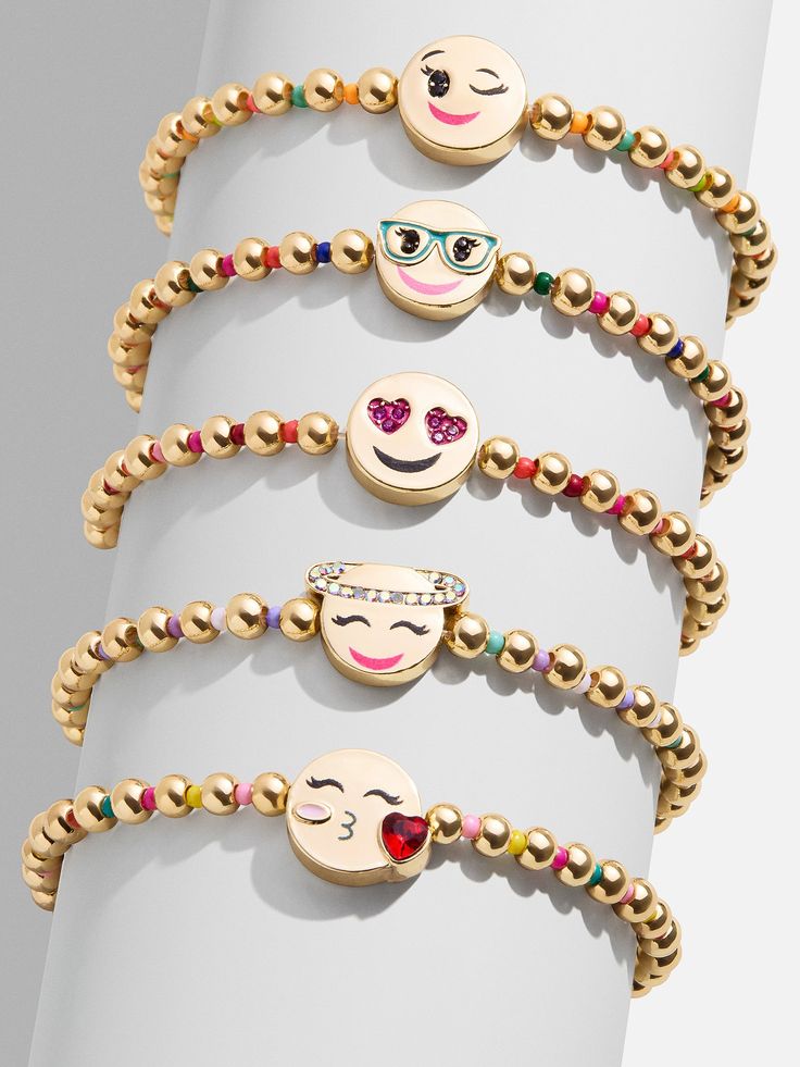 The Kids' Emoji Pisa Bracelet Set comes with five unique gold beaded bracelets. Each bracelet is complete with a bead in the center in a range of fun emoji motifs: the winky face, the smarty pants face, the crush face, the angel face, and the kissy face. Gift as a set to your little one, or split them apart to gift to them and all of their friends. Please note: intended for children 3+, packaging may vary. Winky Face, Kissy Face, Gold Bead Bracelets, Angel Face, Beaded Stretch Bracelet, Pisa, Gold Beads, Stretch Bracelets, Bracelet Designs