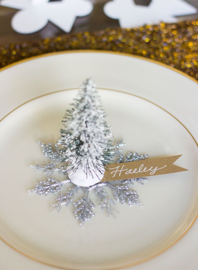 a white plate topped with a silver christmas tree