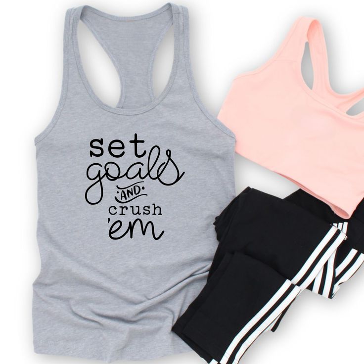 Get ready to conquer your fitness goals in style with this Set Goals & Crush 'Em motivational women's workout tank! This racerback style tank is designed to keep you cool and comfortable during your workouts, while the empowering message will keep you motivated. Available in a variety of colors, this tank is perfect for adding a pop of inspiration to your activewear collection. Whether you're hitting the gym or going for a run, this tank will be your go-to choice for staying motivated and stylish. Workout Tanks For Women, Athleisure Racerback Tank Top For Gym, Sportswear Racerback Tank Top For Gym, Sports Season Workout Tank Top With Letter Print, Workout Tank Top With Letter Print, Athletic Fit Racerback Tank Top For Gym, Sweat Resistant Racerback Tank Top For Gym, Sweat-resistant Racerback Tank Top For Gym, Sporty Letter Print Tank Top For Workout