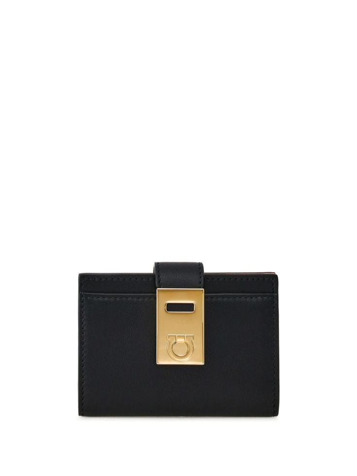 black leather tonal stitching Gancini plaque gold-tone hardware colour-block design magnetic strap fastening internal logo stamp internal card slots contrast lining Black Wallets With Logo Plaque For Everyday Use, Elegant Everyday Wallets With Gold-tone Logo Plaque, Modern Black Wallet With Logo Plaque, Classic Formal Wallets With Gold-tone Hardware, Leather Wallets With Logo Plaque, Leather Wallets With Logo Plaque For Everyday, Modern Wallets With Logo Plaque For Everyday, Black Business Wallet With Logo Plaque, Leather Wallet With Gold-tone Logo Plaque