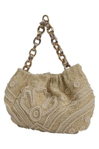 Ivory handbag with all-over bead work, placement floral motifs and silver-gold tone intertwined linked chain. 
Type: Embellished
Composition: Lining: Leather
Color: White
Intertwined link chain
3-card slot
Closure: Magnet clasp
Size (inch): H x W x Depth: 5 x 8.5 x 1.25 - Aza Fashions Cream Beaded Bags For Reception, Beige Beaded Bags For Reception, Luxury Beaded Cream Bag, Luxury Beaded Cream Bags, Luxury Cream Beaded Bag, Luxury Beaded Evening Bag For Reception, Elegant Beaded Shoulder Bag For Reception, Luxury Embellished Cream Bags, Luxury Hand Embellished Shoulder Bag For Formal Occasions