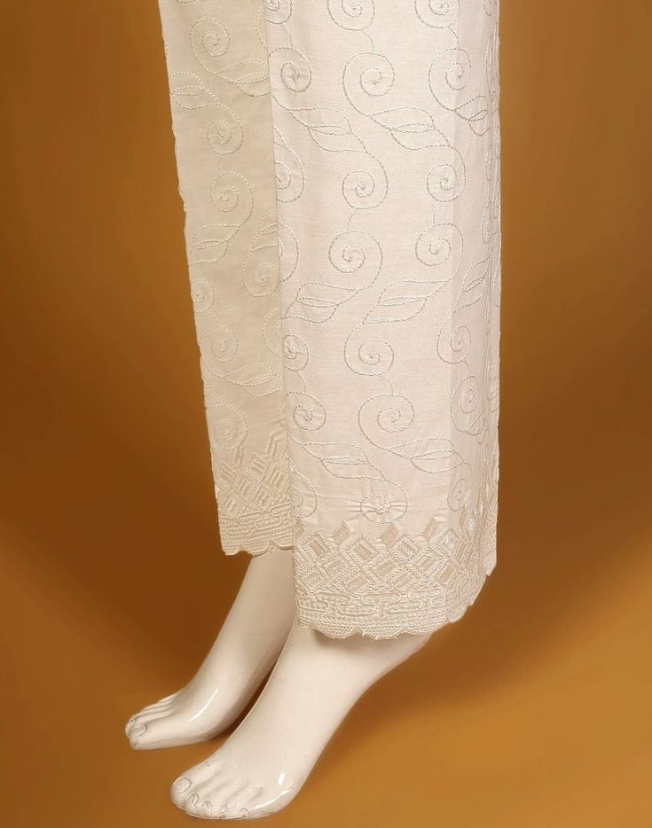 Description : Embroidered Cotton Trouser. Country of Origin : Pakistan Care Instruction : Should be washed in gentle cycle and hung to dry. Color may bleed so please be mindful of other items with it. Disclaimer : Size chart provides reference sizes and actual sizes might be slightly different from the size chart. Summer Cotton Pants With Chikankari Embroidery, White Cotton Bottoms With Embroidered Hem, Ecru Cotton Bottoms For Summer, White Cotton Pants With Resham Embroidery, Spring Cotton Bottoms With Chikankari Embroidery, Summer Cotton Bottoms With Embroidered Border, Traditional Cotton Bottoms With Floral Embroidery, Cotton Bottoms With Chikankari Embroidery For Spring, White Cotton Bottoms With Floral Embroidery