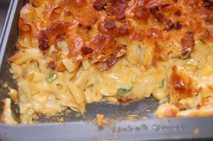 a casserole dish with bacon and cheese on it's side, in a pan