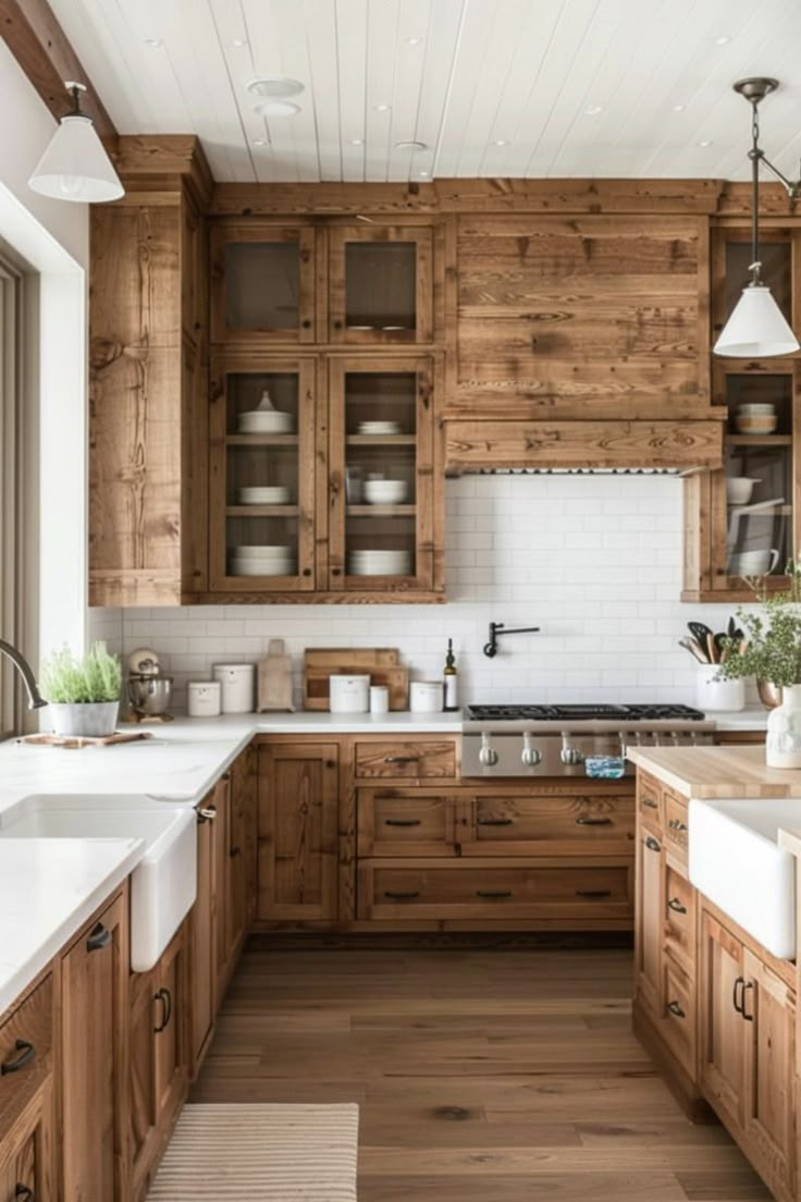 a large kitchen with wooden cabinets and white counter tops, along with wood flooring