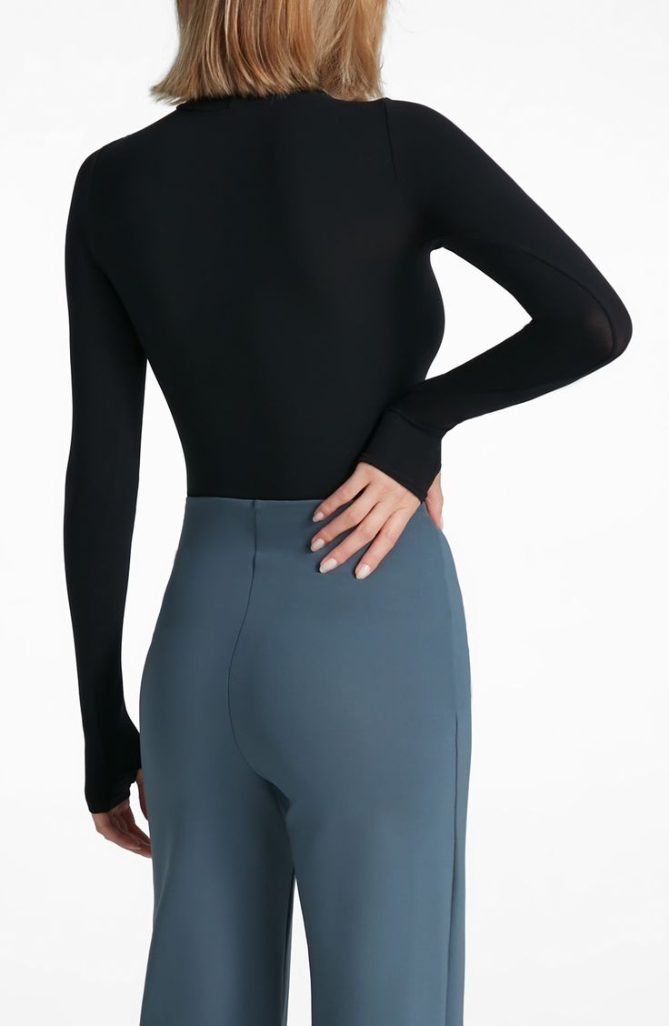 This buttery-soft turtleneck top fits like a second skin thanks to ample stretch that's blended right in. Turtleneck Long sleeves 84% nylon, 16% elastane Machine wash, dry flat Imported Elegant Long Sleeve Nylon Tops, Black Micro-elastic Nylon Top, Sleek High Stretch Tops With Thumbholes, Versatile High Stretch Turtleneck, Sleek Turtleneck Tops With Thumbholes, Chic High Stretch Nylon Top, Elegant High Stretch Tops With Thumbholes, Black Second-skin Tops For Workwear, Versatile Stretch Turtleneck For Layering