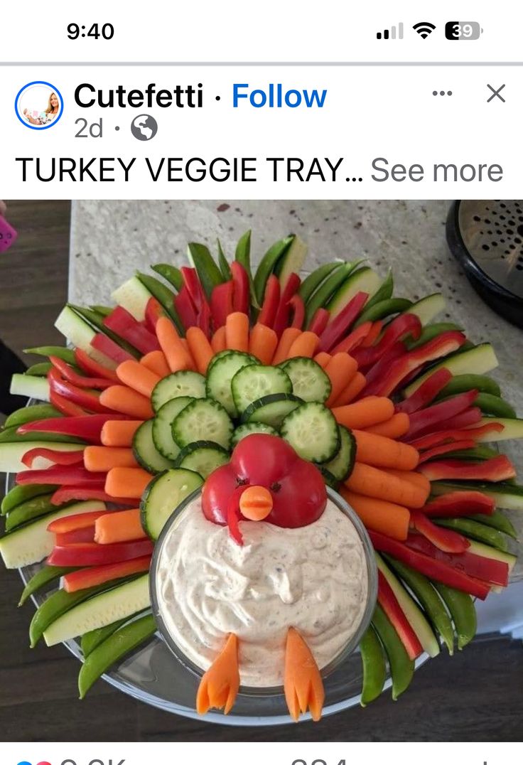 a fake turkey made out of veggies and carrots on a platter